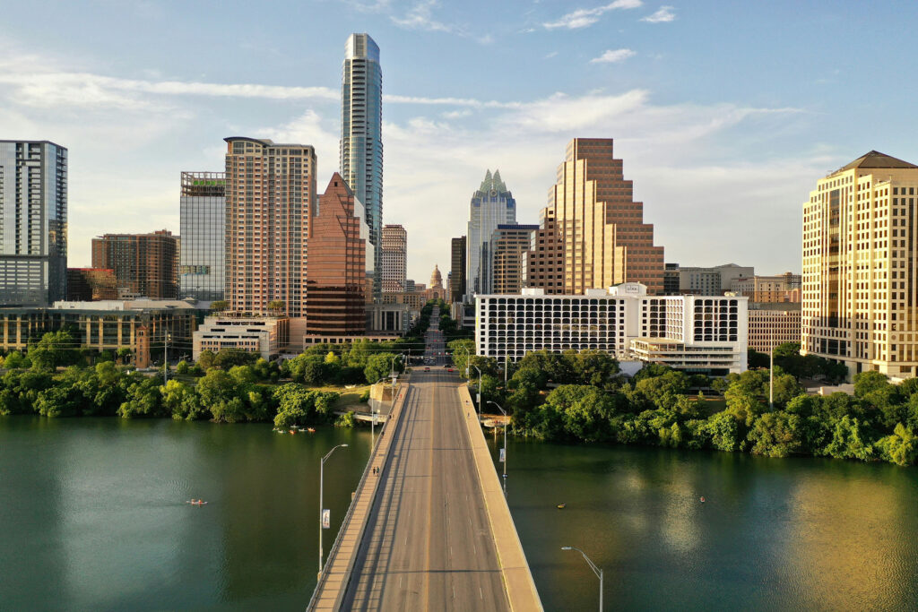Congress Avenue Bridge crosses the Colorado River toward downtown Austin and the Texas Capitol.